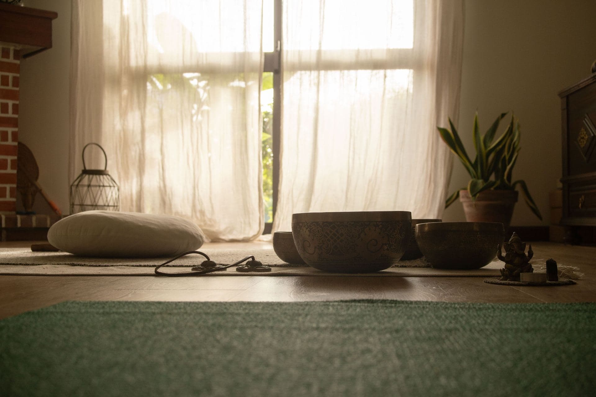 Singing bowls near a sunlit window